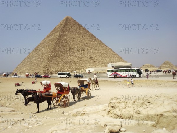 The Great Pyramid of Giza, nestled in the sands of the Sahara Desert, features a pharaonic necropolis. One of the Seven Wonders of the Ancient Egyptian World, it is located on the Giza Plateau. This architectural landmark attracts tourists, travelers, and adventurers from around the world. Cairo. Egypt