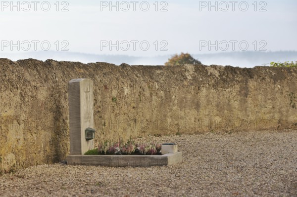 Lonely children's grave on a cemetery wall, fresh plants for All Saints Day, Upper Bavaria, Bavaria, Germany