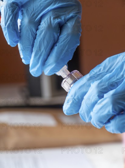 Istambul, Turkey October 21st 2025 Nurse hands in blue gloves preparing Sandostatin Anti growth hormone injection for patient treatment by Novartis