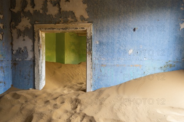 Building taken over by desert sand, in a former diamond town, today a ghost town, Lost Place, Kolmanskuppe, Lüderitz, Karas region, Namibia