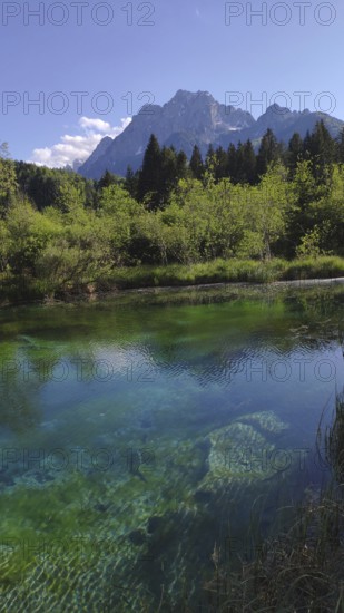 Zelenci Nature Reserve with a view of Triglav National Park, Slovenia