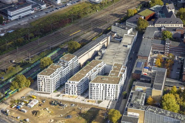 Aerial photo, construction site new literature quarter for offices and apartments between Sachsenstraße and Bert-Brecht-Straße, S-Bahn parking position, Südviertel, Essen, Ruhr area, North Rhine-Westphalia, Germany, construction area, building land, building plots, construction project, construction site, DE, Europe, commercial premises, commercial area, industrial park, commercial use, industrial area, industrial site, aerial photography, aerial photography, new building, overview, bird's eye view, birds-eyes view, overview