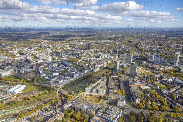 Aerial view, construction site new literature quarter for offices and apartments between Sachsenstraße and Bert-Brecht-Straße, S-Bahn parking position, view of the city, town hall and campus Essen construction site, distant view with sky and clouds, Südviertel, Essen, Ruhr region, North Rhine-Westphalia, Germany, construction site, building plot, construction project, construction site, DE, Europe, commercial space, commercial area, industrial park, industrial park, commercial location, commercial use, industrial area, industrial site, aerial photography, aerial photography, aerial photography, new building, overview, bird's eye view, overview
