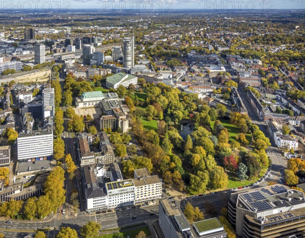 Aerial view, Essen Aalto Theatre and Essen Philharmonic with Stadtgarten on Essen Campus, autumn trees, Südviertel, Essen, Ruhr area, North Rhine-Westphalia, Germany, railway station, construction area, building land, building plots, construction project, construction site, trees in autumn colors, office building, DE, Deutsche Bahn AG, Europe, events, main station, autumn, autumn colors, autumn atmosphere, culture, art, aerial view, aerial view, photo photography, aerial photography, new building, theatre, overview, venue, bird's eye view, birds-eyes view, green lung, cultural use, overview