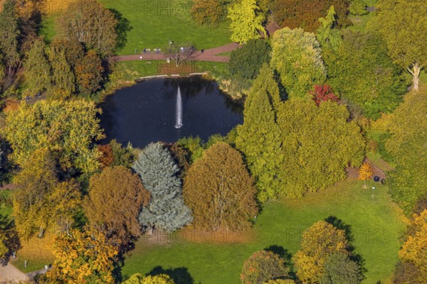 Aerial view, fountain and lake in city garden with autumn trees, Südviertel, Essen, Ruhr region, North Rhine-Westphalia, Germany, colorful trees, trees in autumn colors, DE, Europe, autumn, autumn colors, autumn forest colors, aerial photography, aerial photography, pond, overview, bird's eye view, forest in autumn colors, birds-eyes view, colorful autumn leaves, autumnal forest, overview