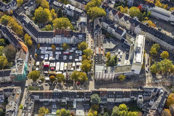 Aerial view, Rüttenscheider Stern office skyscraper and weekly market market on the market square, construction site and façade covering of a house Klarastraße corner Rüttenscheider Platz, Rüttenscheid, Essen, Ruhr area, North Rhine-Westphalia, Germany, construction site, building plots, construction project, construction site, DE, Europe, aerial photo, aerial photography, aerial photography, market place, market stands, overview, bird perspective, weekly market, birds-eyes view, overview