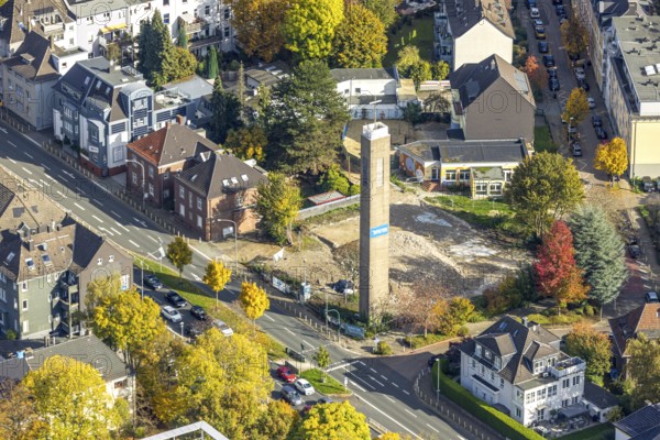 Aerial view, demolition of the evangelical reconciliation church, planned retirement home with daycare center, free-standing church tower, Rüttenscheid, Essen, Ruhr region, North Rhine-Westphalia, Germany, retirement home, construction work, building area, building land, building plots, construction project, construction site, DE, Europe, kindergarten, day care center, daycare center, aerial photography, aerial photography, new building, retirement home, retirement home, retirement home, senior center, tower, overview, bird's eye view, birds-eyes view, overview
