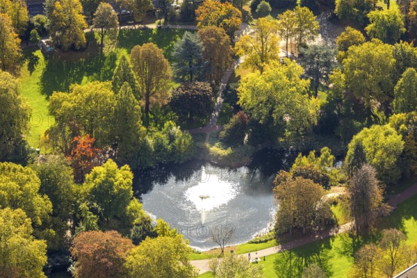 Aerial view, fountain and lake in backlight in city garden with autumn trees, Südviertel, Essen, Ruhr region, North Rhine-Westphalia, Germany, colorful trees, trees in autumn colors, DE, Europe, autumn, autumn colors, autumn forest colors, aerial photography, aerial photography, pond, overview, bird's eye view, forest in autumn colors, birds-eyes view, colorful autumn leaves, autumn forest, overview