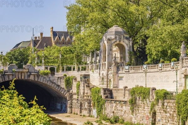 City park with large green wall, pagoda and underpass for the Vienna River, Vienna, Austria