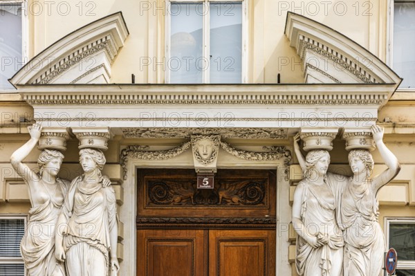 Women as supporting marble statues at a historic building, Josefsplatz, Vienna, Austria