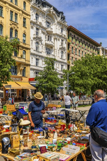 Antique and flea market, on the Chain Bridge south of the Naschmarkt, behind the historic facades of the buildings on the left Wienzeile, Vienna, Austria