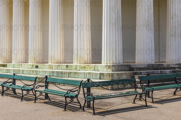 Columns of the Temple of Theseus, with green benches in front of it, Volksgarten, Vienna, Austria