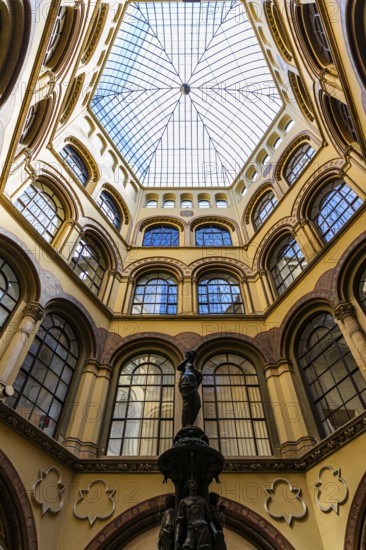 Donaunix fountain and glass dome in Palais Ferstel, Vienna, Austria