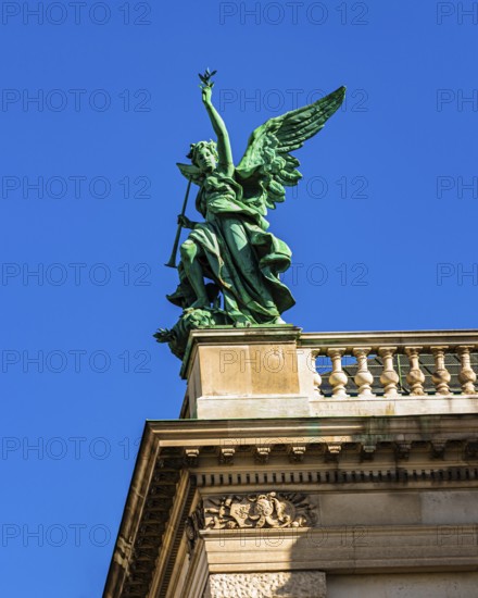A bronze angel on the roof of the Kunsthistorisches Museum on Maria-Theresien-Platz, Vienna, Austria