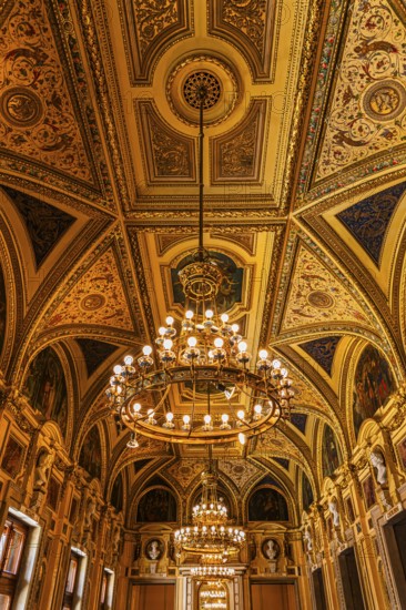 Sumptuous room and chandelier in the Vienna State Opera, Vienna, Austria