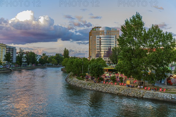 Herrmann beach bar on the Danube Canal in the evening sun, near the Urania observatory, Vienna, Austria