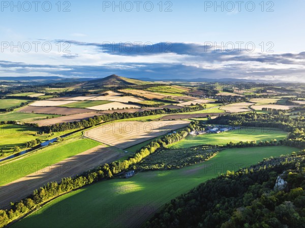 Fields and Farms over River Teviot and Minto Crags from a drone, Roxburghshire, Scottish Borders, Scotland, UK