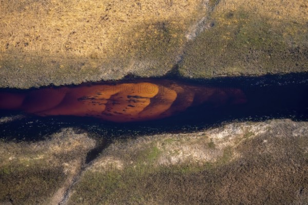 Wide river in savanna landscape, aerial view, Okavango Delta, Botswana
