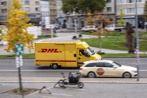 DHL vehicle passes by taxis, at Düsseldorf-Bilk railway station, taxi stand, North Rhine-Westphalia