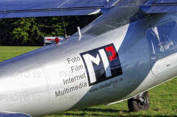 A Dornier Do-27A-1 aircraft, registration D-EFFB, with advertising for MediaProd GbR as part of an air show on Rossfeld in Metzingen-Glems, Baden-Württemberg, Germany, for editorial use only