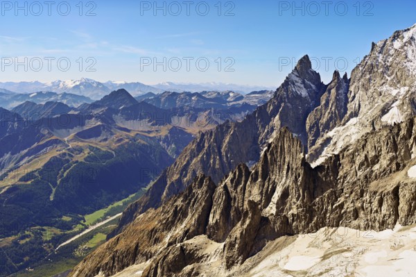 View of the mountain l'Aiguille Noire de Peuterey, in the back the Italian Alps, Pointe Helbronner viewing terrace, Chamonix-Mont-Blanc, Haute-Savoie, Italy watershed, France