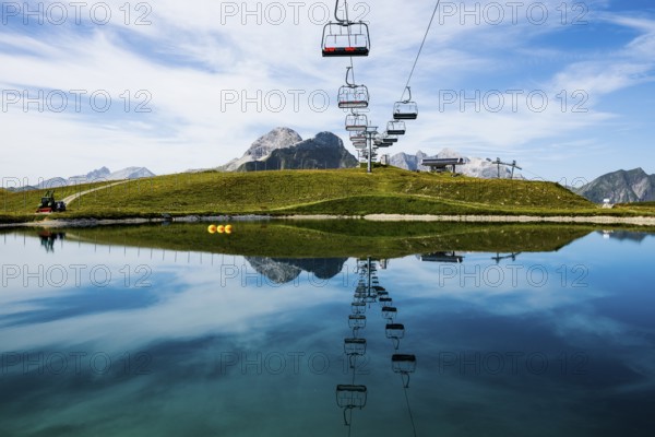 Mountain landscape with reservoir and chairlift, Saloberkopf, Warth, Bregenzerwald, Vorarlberg, Alps, Austria
