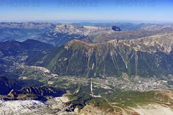 View from the Aiguille du Midi mountain station observation deck into the valley with the city, Chamonix-Mont-Blanc, Haute-Savoie, France