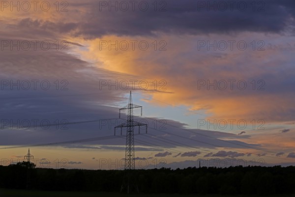 Clouds, sunset, high-voltage pole, Melbeck, Samtgemeinde Ilmenau, Lower Saxony, Germany