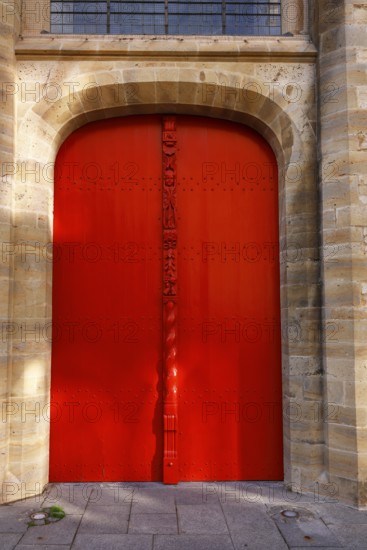Historic St. Salvator Cathedral, Sint-Salvatorskathedraal, in the old town of Bruges, entrance, portal, red wooden door with decorative carvings and an angel figure, UNESCO World Heritage Site, Flanders, Belgium