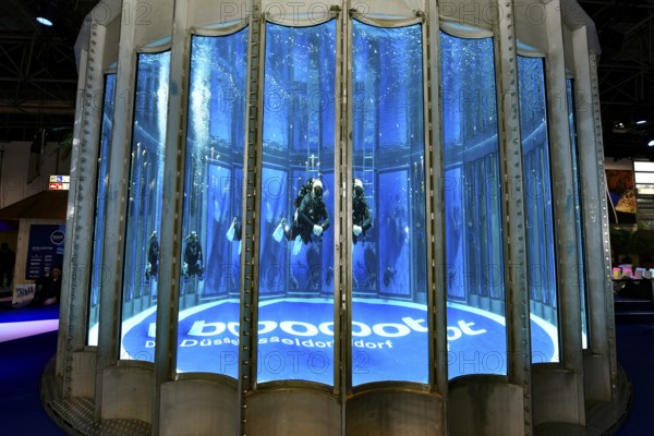 Diving tower with divers, logo lettering boot Düsseldorf on the ground in exhibition hall 12 of Messe boot, Düsseldorf, North Rhine-Westphalia, Germany