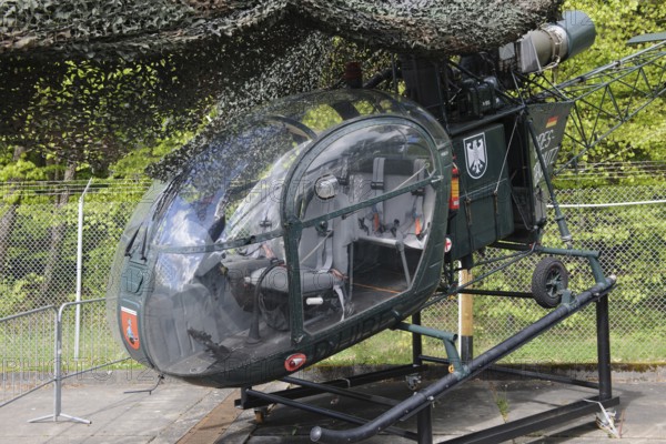 Disused small light helicopter helicopter Alhouette II from the Federal Border Guard in the Point Alpha open-air museum on the former inner German border between FRG West Germany and GDR Eastern Bloc, Point Alpha Memorial, former zone border, Rasdorf, Hesse, Geisa, Thuringia, Germany