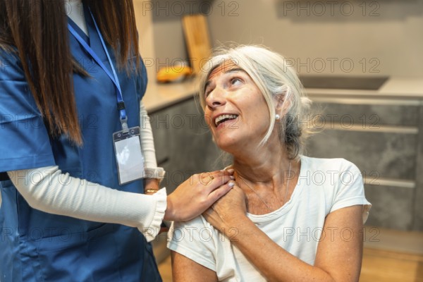 Caregiver gently supporting senior woman at home, offering compassionate medical assistance, personalized attention and comforting touch to promote wellbeing and trust