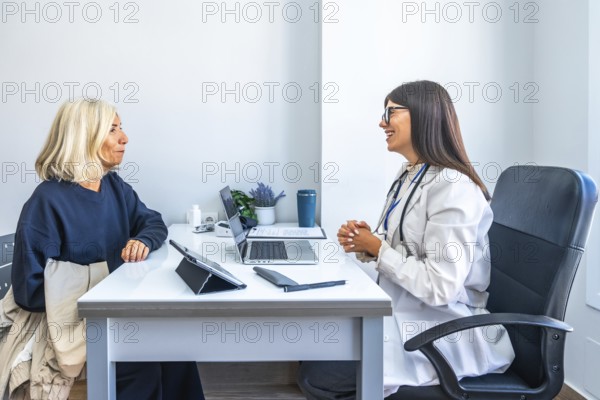 Doctor consulting with an older woman, having a medical appointment in a modern office, providing professional advice and support during her healthcare visit
