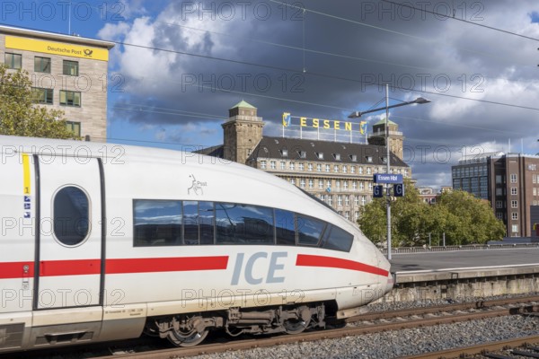 ICE train on track 2 in Essen main station, view of the city center, Handelshof building with Essen lettering, North Rhine-Westphalia, Germany