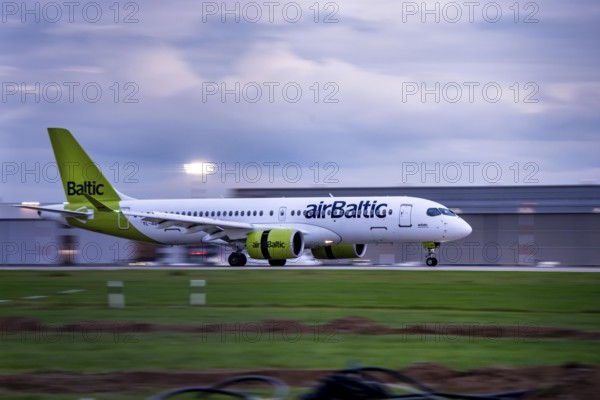 AirBaltic Airbus A220 landing at Düsseldorf Airport, North Rhine-Westphalia, Germany
