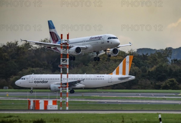 Eurowings Airbus landing at Düsseldorf airport, Condor Flieger waiting for takeoff, North Rhine-Westphalia, Germany