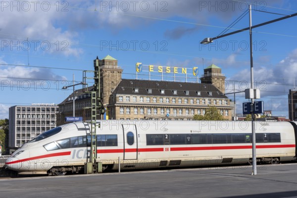 ICE train on track 1 in Essen main station, view of the city center, Handelshof building with Essen logo, North Rhine-Westphalia, Germany