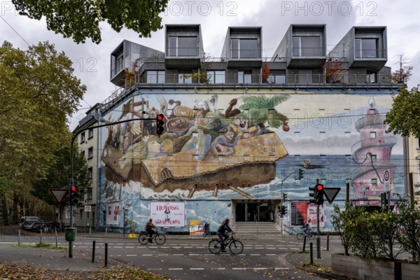 The Bilker Bunker, former air raid shelter from 1944, is a listed building, used as a cultural institution since 2023, exhibitions, concerts, events, gastronomy, mural time travelers, on the roof there are 5 cubes with apartments, private property, conversion of civil protection areas, Düsseldorf, North Rhine-Westphalia, Germany