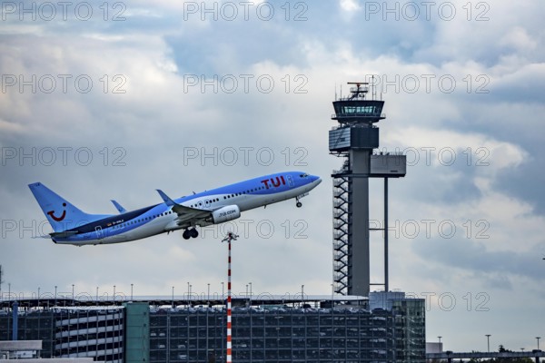 TUI Fly Boeing 737-800 taking off from Düsseldorf Airport, Air Traffic Control Tower, North Rhine-Westphalia, Germany