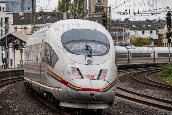 Rainbow ICE, ICE 3 type, with rainbow paint, promotes tolerance, in front of Düsseldorf main station, here near Volksgarten station, North Rhine-Westphalia, Germany