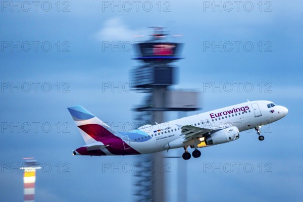 Eurowings Airbus A319 taking off from Düsseldorf Airport, Air Traffic Control Tower, North Rhine-Westphalia, Germany