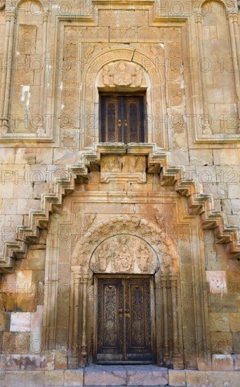 Elaborately designed façade with stairs and ornately decorated doors, Noravank monastery, Surb Astvatsatsin mausoleum church, Noravank, Vayots Dzor province, Wajoz Dzor, Armenia, Caucasus