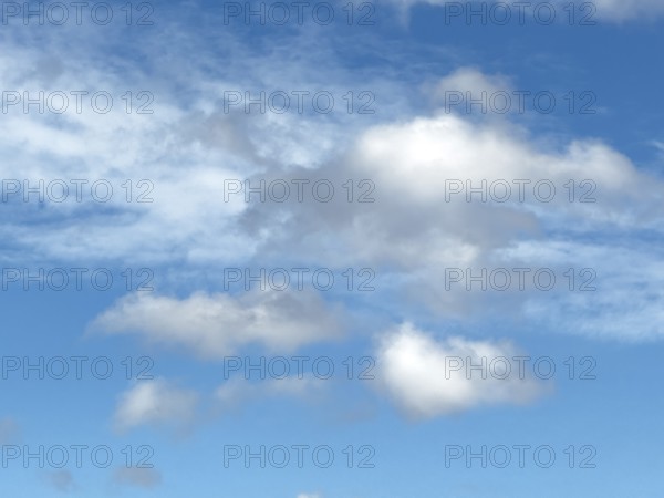 White clouds Stratocumulus and Altocumulus loose cloudiness cloudy against blue sky, international