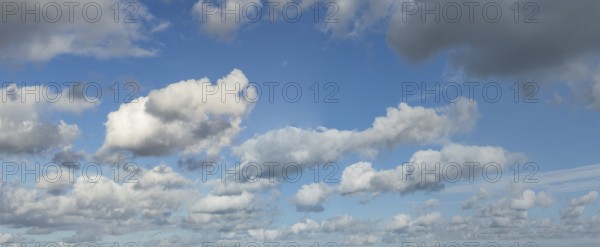 White clouds driven by approaching storm Cumulus above Stratocumulus loose to thick cloudiness cloudy against blue sky, international