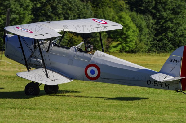 A double-decker Stampe-Vertongen SV-4B with registration D-EFEM during a flight demonstration as part of an air show on Rossfeld in Metzingen-Glems, Baden-Württemberg, Germany, for editorial use only
