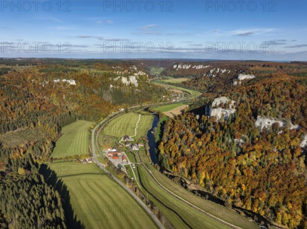 Aerial view of Upper Danube Valley surrounded by autumn vegetation, on the horizon Werenwag Castle, Sigmaringen district, Baden-Württemberg, Germany