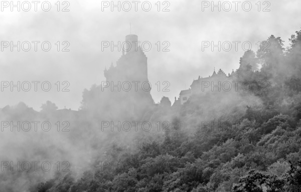 Lichtenstein Castle, also known as Württemberg's fairytale castle, built in the style of historicism, in fog, black and white, Lichtenstein, Swabian Jura, Baden-Württemberg, Germany