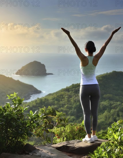 A woman is standing on a mountain top, looking out over the ocean. She is wearing a white tank top and grey pants, AI generated