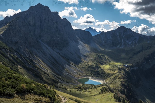 View from the Sallfelder Höhenweg hiking trail to Lache See and mountains of the Allgäu Alps, on the left Lachenspitze, Tannheimer Mountains, Tannheimer Valley, Tyrol, Austria