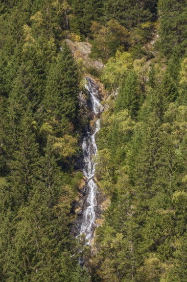 Waterfall with forest on Wilde Wasser Weg in autumn, WildeWasserweg, Stubai Valley, Tyrol, Austria